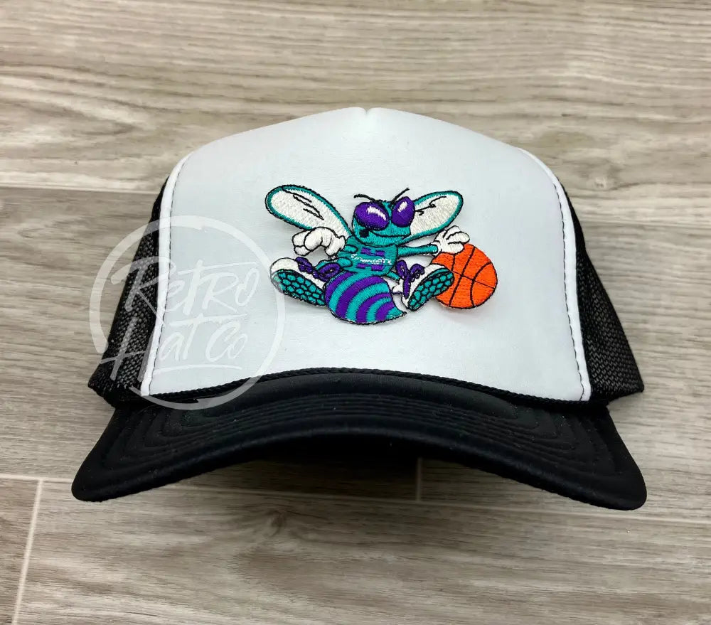 Vintage 90s Charlotte Hornets Patch on Black/White Meshback Trucker Hat