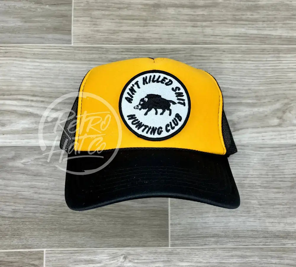 Ain’t Killed Shit on Black/Gold Meshback Trucker Hat